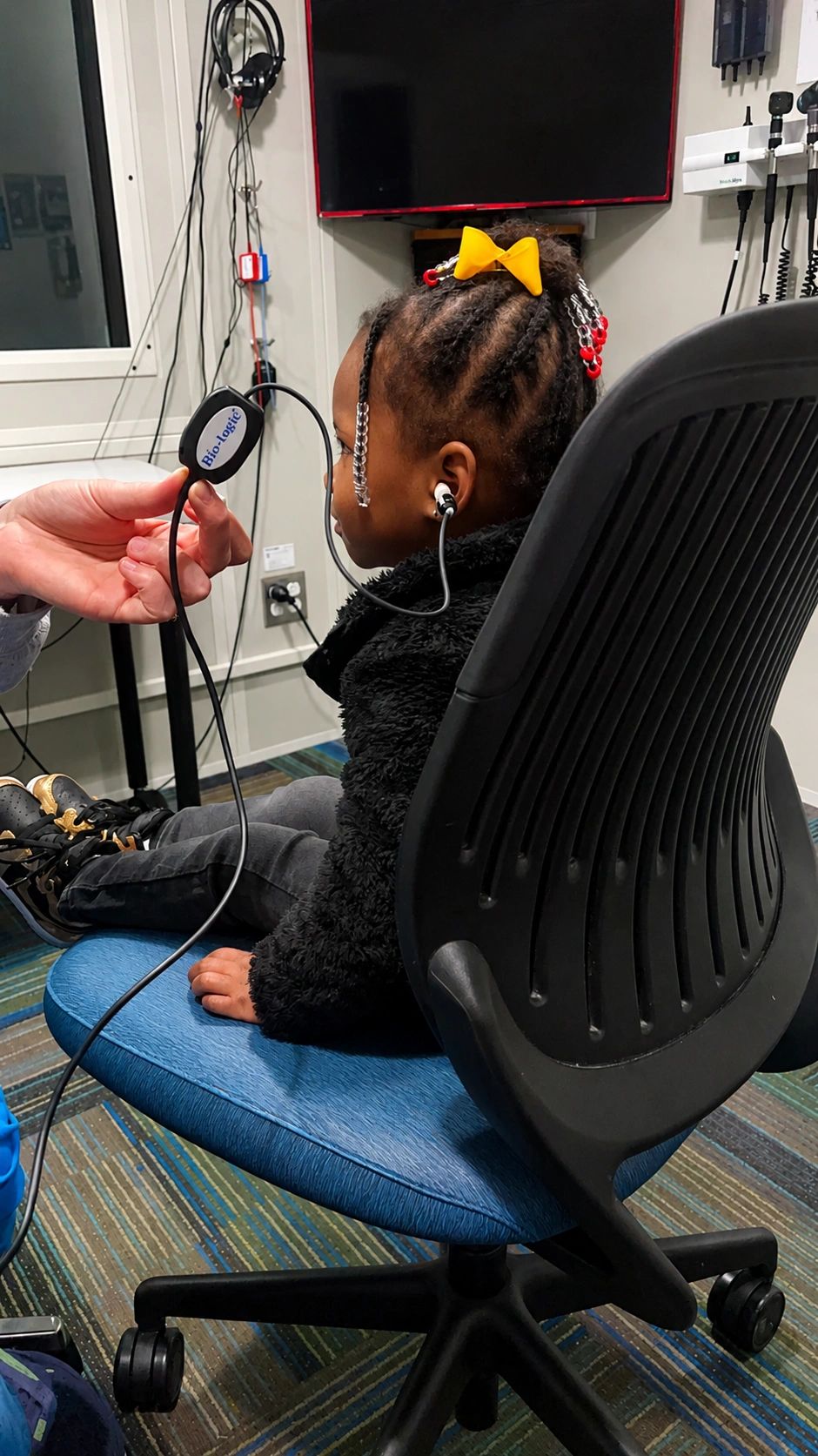 Child wellness visit with caring nurse
